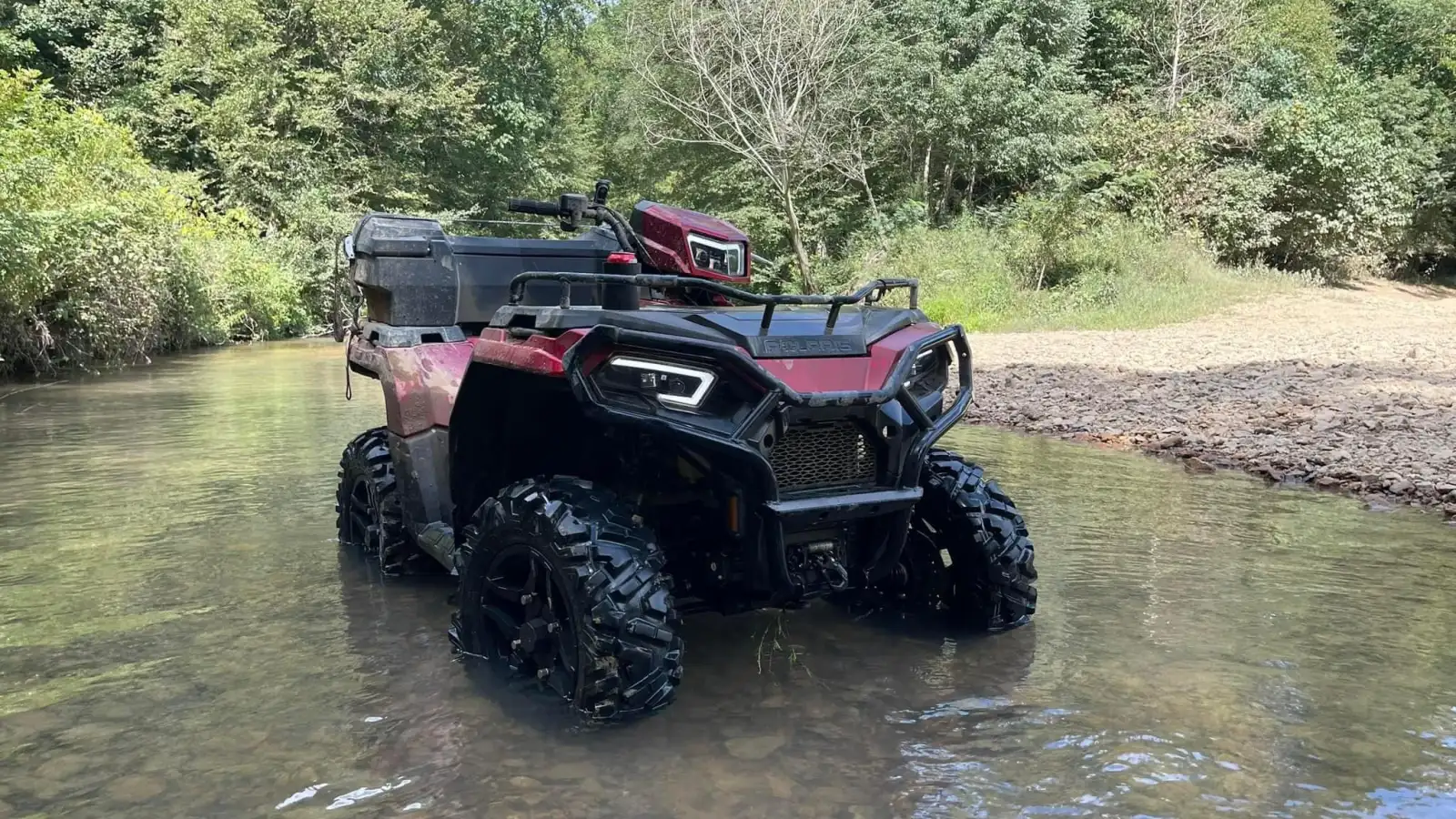 374737782_143185198849099_259242098773330334_n a truck is parked on the side of a river
